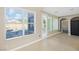 Living room with large window, access to the backyard, and view into arched doorway at 258 Chamomile Dr, Henderson, NV 89015