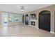 Inviting living room with a fireplace, built-in cabinets, and sliding glass door to the backyard at 258 Chamomile Dr, Henderson, NV 89015