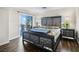 This main bedroom features a mirrored bed frame, tufted headboard and balcony access at 258 Chamomile Dr, Henderson, NV 89015