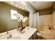 Spa-like bathroom featuring dual sinks, decorative mirror and soaking tub for the ultimate relaxation at 3048 Scalise Ct, Las Vegas, NV 89141