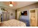 Inviting bedroom featuring a bed, dresser and attached bathroom at 3048 Scalise Ct, Las Vegas, NV 89141