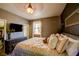 Relaxing bedroom featuring an updated bed, large dresser and TV for late-night entertainment at 3048 Scalise Ct, Las Vegas, NV 89141