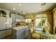 Modern kitchen featuring grey cabinets, stainless steel appliances, and sliding glass doors to patio at 3048 Scalise Ct, Las Vegas, NV 89141