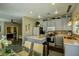 Modern kitchen featuring grey cabinets, stainless steel appliances, and breakfast bar at 3048 Scalise Ct, Las Vegas, NV 89141
