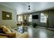 Open-concept living room featuring tile floors, lots of natural light, and modern ceiling fan at 3048 Scalise Ct, Las Vegas, NV 89141