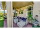 Inviting covered patio with comfortable seating, ceiling fan, and serene outdoor views at 3048 Scalise Ct, Las Vegas, NV 89141
