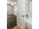 Bathroom with a tub, shower, tile flooring, and view into the bedroom at 3135 S Mojave Rd # 152, Las Vegas, NV 89121