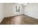 Bright bedroom features wood-look flooring and a window offering natural light at 3135 S Mojave Rd # 152, Las Vegas, NV 89121