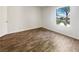 Bright bedroom features a window offering natural light and wood-look flooring at 3135 S Mojave Rd # 152, Las Vegas, NV 89121