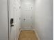 Hallway featuring two doors and neutral-toned tile flooring at 3135 S Mojave Rd # 152, Las Vegas, NV 89121