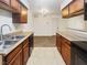 Spacious kitchen features granite countertops with stainless steel sink at 3135 S Mojave Rd # 152, Las Vegas, NV 89121