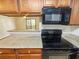 Kitchen featuring granite countertops and wooden cabinets at 3135 S Mojave Rd # 152, Las Vegas, NV 89121