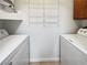 Convenient laundry room includes washer, dryer, and shelving at 3135 S Mojave Rd # 152, Las Vegas, NV 89121