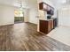 Open living area with wood-look floors adjacent to the kitchen at 3135 S Mojave Rd # 152, Las Vegas, NV 89121