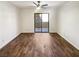 Spacious living area with wood-look floors and sliding glass doors to the outside at 3135 S Mojave Rd # 152, Las Vegas, NV 89121