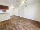 Open floorplan with living area featuring wood-look floors and neutral walls at 3135 S Mojave Rd # 152, Las Vegas, NV 89121