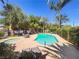 Community pool with palm trees and lounge chairs offers a resort-like experience at 3135 S Mojave Rd # 152, Las Vegas, NV 89121
