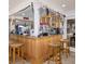 Home wet bar includes seating, lots of decor, and a convenient beverage dispenser at 3233 Southridge Ave, Las Vegas, NV 89121