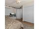 The bedroom features wood floors and white closets that offer plenty of storage at 3233 Southridge Ave, Las Vegas, NV 89121