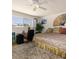 A bedroom features a window for natural light and hardwood flooring with a ceiling fan at 3233 Southridge Ave, Las Vegas, NV 89121