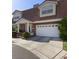 Charming two-story home boasts a well-manicured yard and an attached two-car garage at 3233 Southridge Ave, Las Vegas, NV 89121