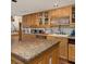Bright kitchen features granite countertops, modern appliances, and ample cabinet space at 3233 Southridge Ave, Las Vegas, NV 89121