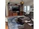 Spacious living room with built-in media center, hardwood floors, and comfortable seating area at 3233 Southridge Ave, Las Vegas, NV 89121