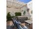 Outdoor patio featuring a hot tub, overhead shade covering, and brick flooring at 3233 Southridge Ave, Las Vegas, NV 89121