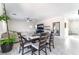 Open concept living and dining area with tile floors and neutral decor at 3309 Green Ice Ave, North Las Vegas, NV 89081