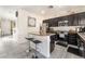 Kitchen featuring an island, stainless appliances, granite counters, and tile flooring at 3309 Green Ice Ave, North Las Vegas, NV 89081