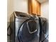 Modern Samsung washer and dryer set with oak cabinets, offering convenience and style at 3309 Green Ice Ave, North Las Vegas, NV 89081