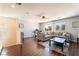 Cozy living room with hardwood floors, comfortable seating, and large windows at 3309 Green Ice Ave, North Las Vegas, NV 89081