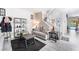 Bright living room with a staircase, modern decor, and access to an outdoor pool at 3309 Green Ice Ave, North Las Vegas, NV 89081
