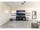 Spacious living room with tile flooring, large screen tv, and open floor plan at 3309 Green Ice Ave, North Las Vegas, NV 89081