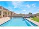 Close-up of the crystal clear backyard swimming pool with stone tile accents at 3309 Green Ice Ave, North Las Vegas, NV 89081