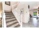 Welcoming staircase with carpeted steps and white railings, leading to the upper level at 3309 Green Ice Ave, North Las Vegas, NV 89081