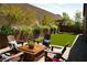 Inviting backyard with a cozy patio, lush greenery, and a tranquil atmosphere at 3395 Sleeping Hills Ave, Henderson, NV 89044