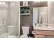 Modern bathroom featuring a glass shower, stylish grey decor, and ample lighting at 3395 Sleeping Hills Ave, Henderson, NV 89044