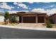 Charming single-story home featuring a brick-accented facade, desert landscaping, and a spacious two-car garage at 3395 Sleeping Hills Ave, Henderson, NV 89044