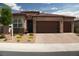 Charming single-story home featuring a brick-accented facade and a spacious two-car garage at 3395 Sleeping Hills Ave, Henderson, NV 89044
