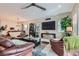 Spacious living room with plush seating, stylish decor, and abundant natural light at 3395 Sleeping Hills Ave, Henderson, NV 89044
