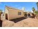 View of the backyard with a patio and desert landscaping, perfect for relaxing and entertaining at 3416 Steppe St, North Las Vegas, NV 89032