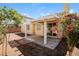 A relaxing covered patio with exterior views of the landscaped backyard at 3416 Steppe St, North Las Vegas, NV 89032