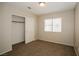 Bedroom with neutral walls, carpet, window with blinds, and closet with sliding doors at 3416 Steppe St, North Las Vegas, NV 89032