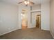 Bedroom view featuring a ceiling fan, vaulted ceilings, arched doorway to the bath, and closet access at 3416 Steppe St, North Las Vegas, NV 89032