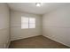 Empty bedroom featuring neutral walls, carpet, and window with blinds at 3416 Steppe St, North Las Vegas, NV 89032