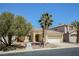 Single-story home with well-maintained landscaping and a two-car garage at 3416 Steppe St, North Las Vegas, NV 89032