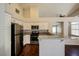 Modern kitchen with stainless steel appliances and granite countertops at 3416 Steppe St, North Las Vegas, NV 89032
