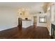 Bright, open-concept living area with a view of the kitchen and fireplace at 3416 Steppe St, North Las Vegas, NV 89032