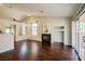 Spacious living room featuring a fireplace, sliding doors, and hardwood floors at 3416 Steppe St, North Las Vegas, NV 89032